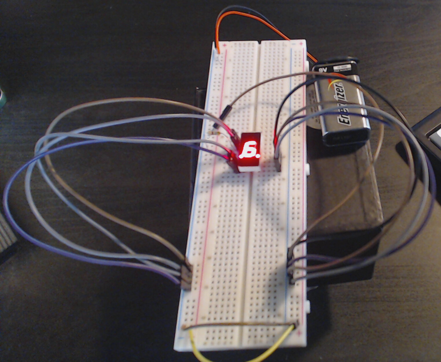 A basic seven-segment display with one segment not powered.